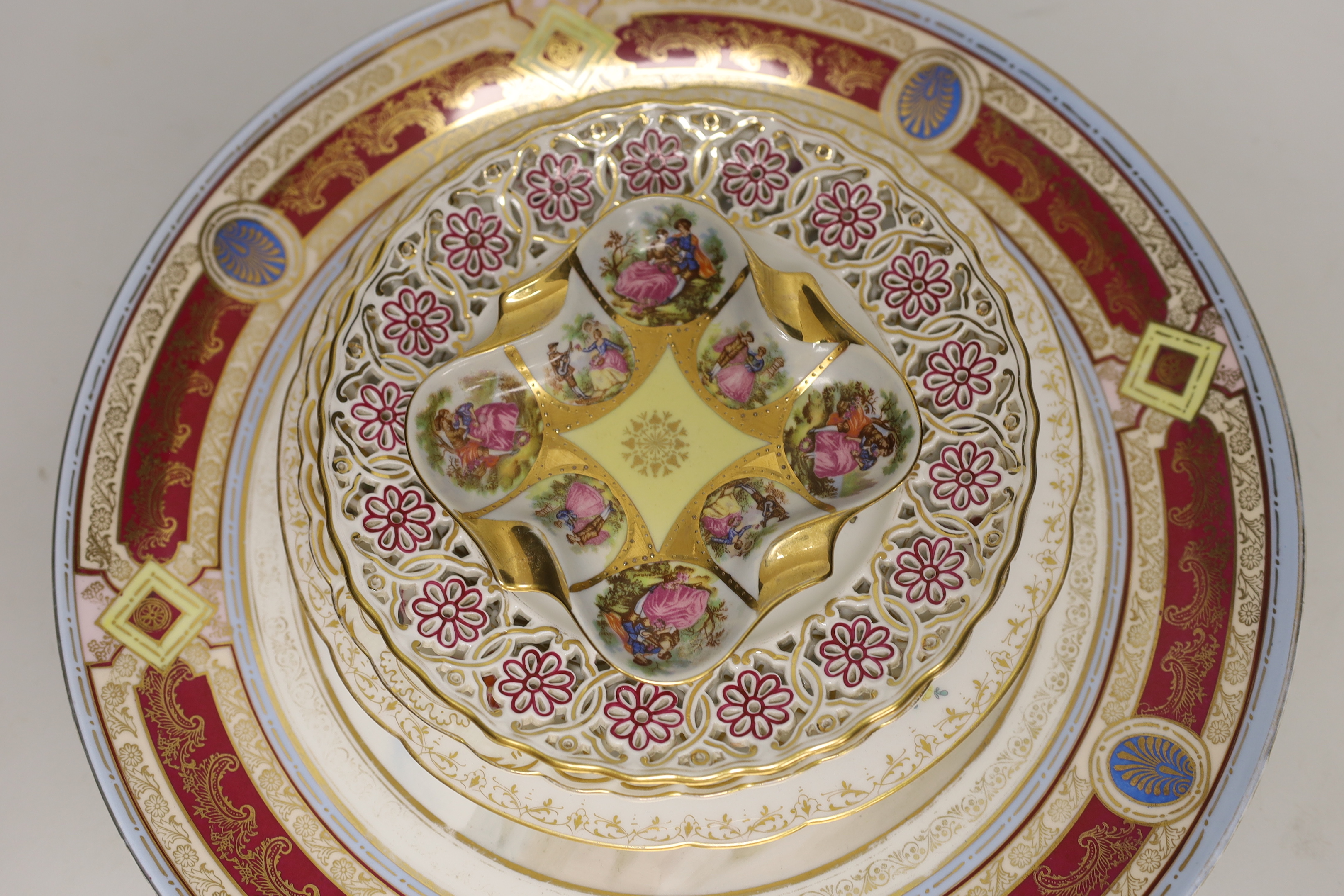 Six Continental porcelain items, including a Sevres style lidded box, a ‘Meissen’ plate with pierced rim, a Dresden plate, etc. largest 31.5cm